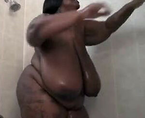 This Massive ebony female strokes in the shower. Her big