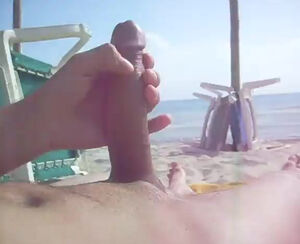 stroking his ample weenie in the beach