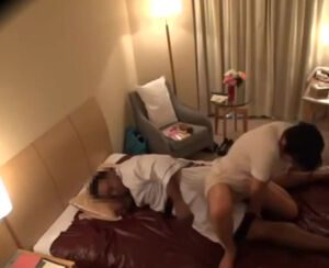 Asian masseur penetrates with ebony customer