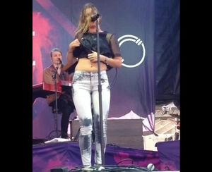 Swedish singer Tove Lo showcasing her bumpers at concert